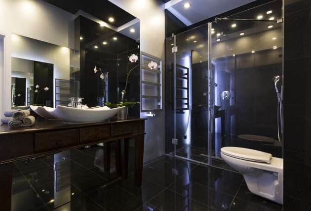 Luxurious bathroom interior Luxurious bathroom interior with shower and dark tiles